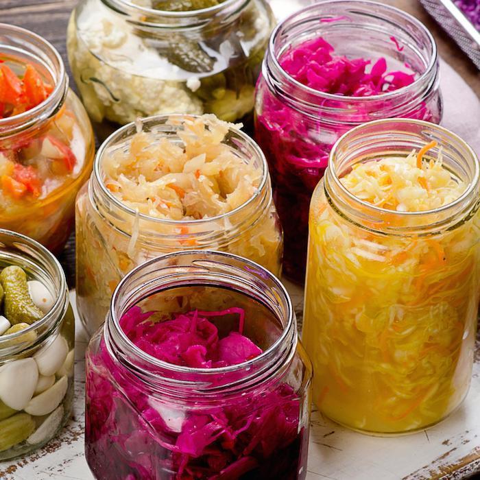 Jars of fermented foods including red cabbage sauerkraut