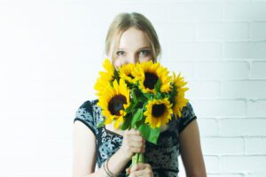 Girl Holding Bunch of Sunflowers | Seedmart